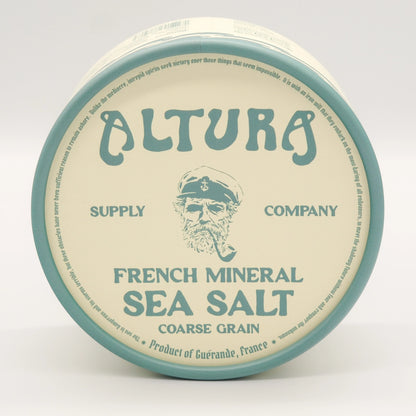 A round tin of Altura French Mineral Sea Salt, Coarse Grain, featuring a cream-colored label with a teal border and illustration of a bearded sailor, on a white background.